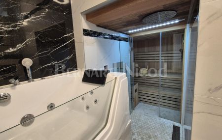 Superbe appartement rénové au rez-de-chaussée avec sauna